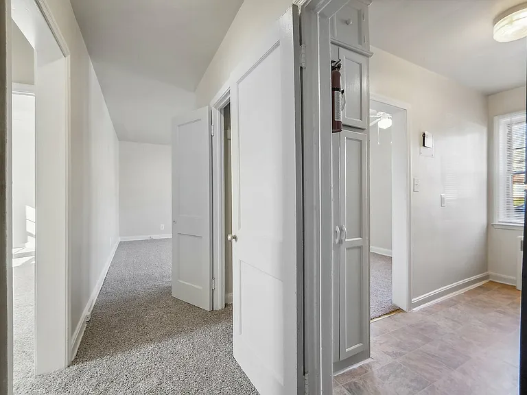 Step into this inviting hallway, a gateway to tranquil and spacious living.