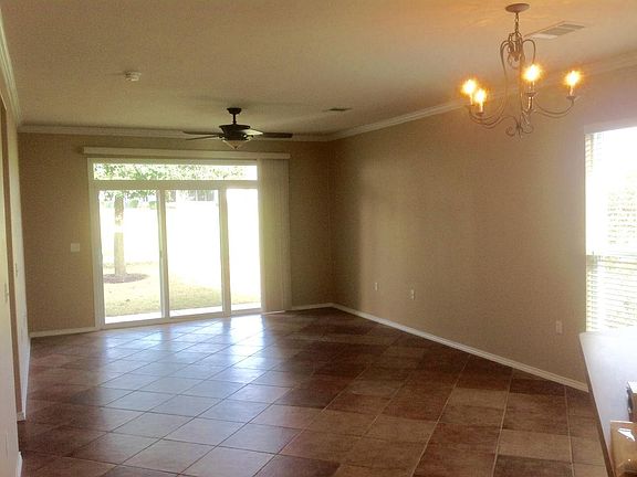 Tiled Living Room with natural lighting and view of Greenbel