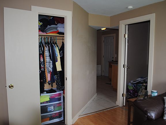 Photo taken in living room (middle room) looking towards the kitchen. Door on right is small rear BR