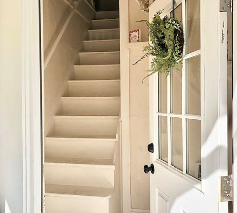 Entry and mud room area- coat hooks behind door and space for shoes