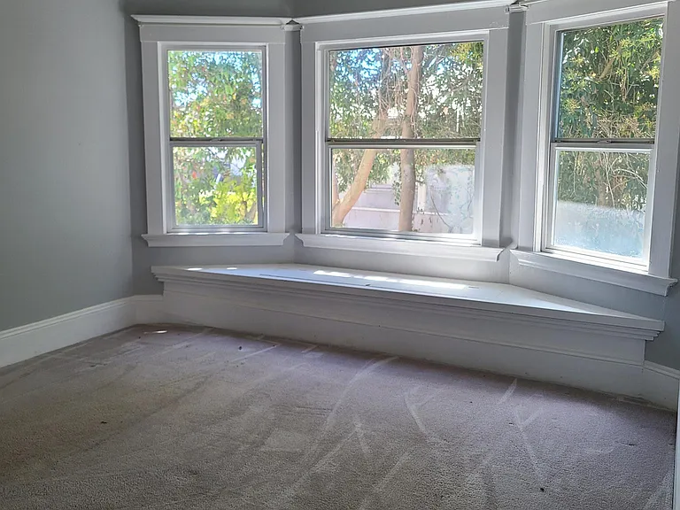 Built-in window seat in the bay window. Additional storage underneath. This large room has a closet as well as a built-in drawers and shelving. Can be a large office, a sizeable guest bedroom and more. The possibilities are endless.