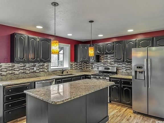 Open kitchen with island. Lots of natural light