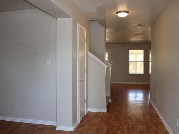 The welcoming entry features a big closet that extends down the length of the wall