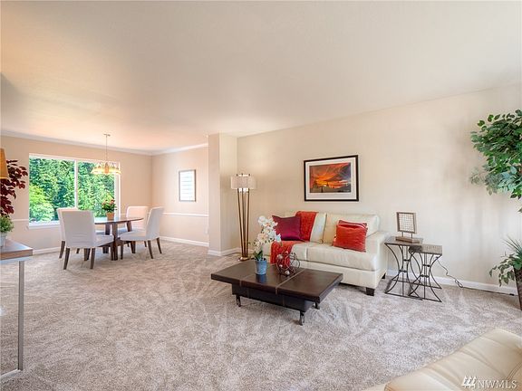 Formal living and dinning room with new carpet and interior paint.