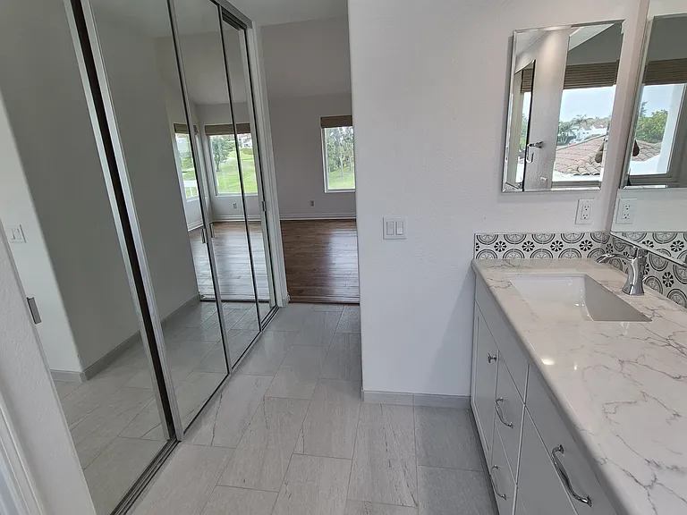 All new bathroom in upstairs suite. Walk-in closets are new.