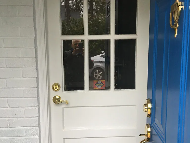 Rear entrance to your private laundry room. Double Exterior Doors for Security - blue door to laundry room. 5 to six feet after, white door leads to kitchen.