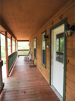 Large Porch at 40' long by 6' wide.  Can't you see yourself sitting here in the morning breeze drinking a hot cup of coffee enjoying the quite sereneness of country living?