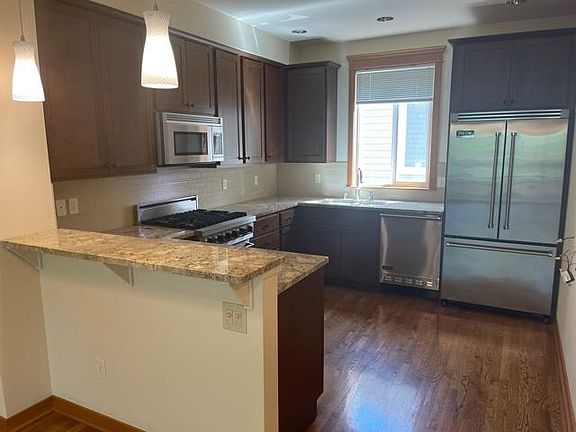 All Viking Appliances! Kitchen with convenient breakfast bar and open to living room space