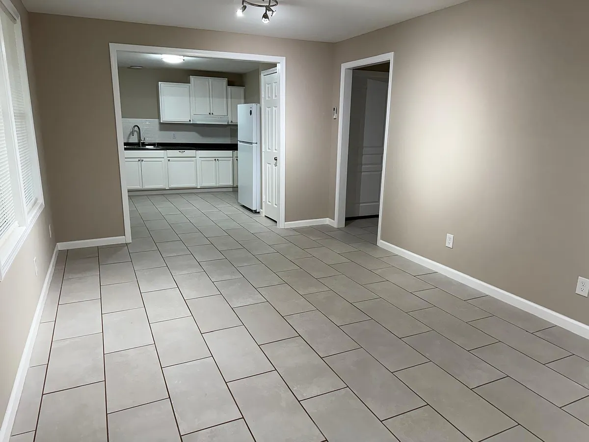 Living room and the kitchen with a breakfast area. - 2786 Denton Rd