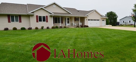 Maintenance Free Front Porch, Well Manicured Front Yard with Irrigation System, Adjustable Basketball Hoop, and 3 Car Wide Driveway