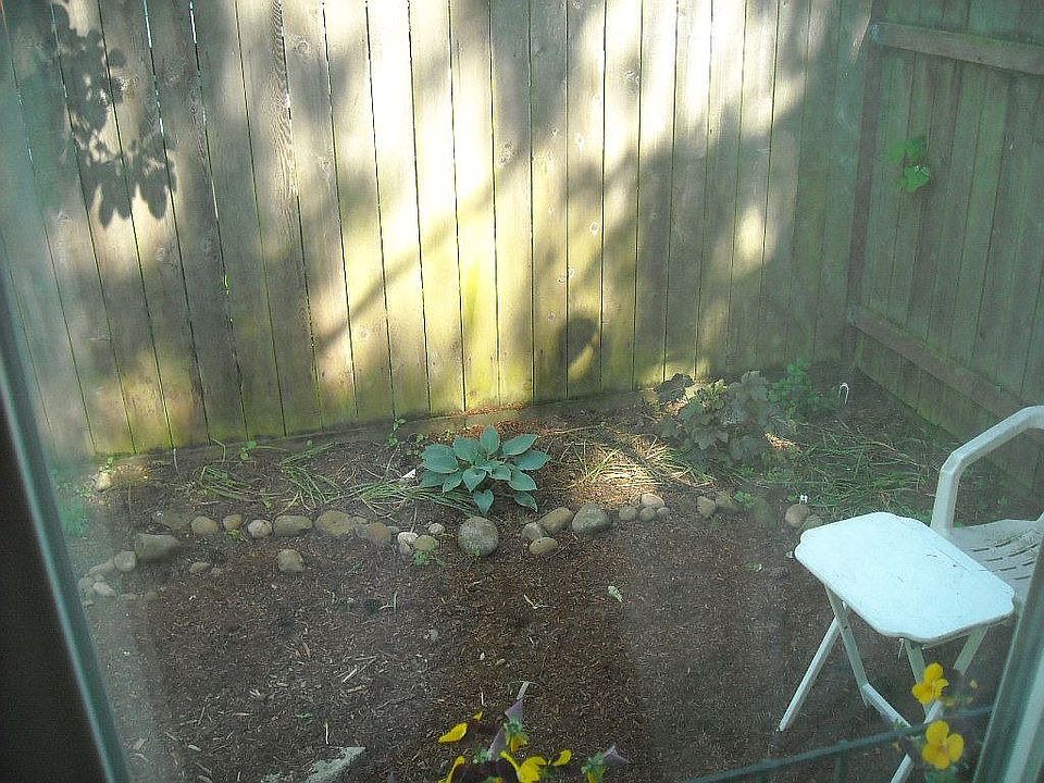 View of side yard from bedroom 1