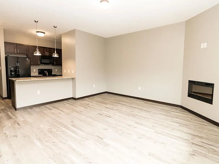 Our spacious living rooms are perfect for relaxing by the cozy fireplace, creating a warm and inviting space for everyday living.