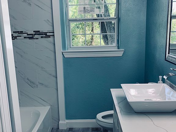 Bathroom with tile and quart