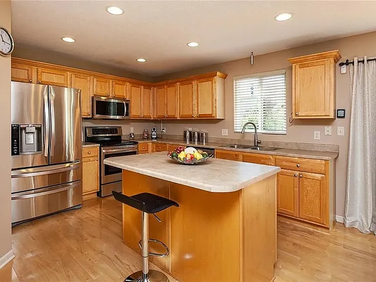 Kitchen is actually the same light sage color as the living room.