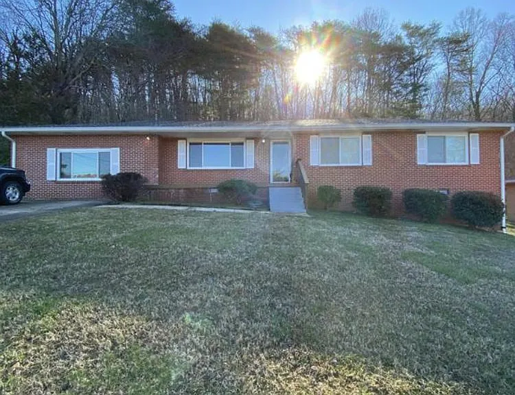 Single story brick home on large 1/2 acre lot