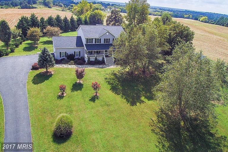 Perched on 2 acres surrounded by farm land