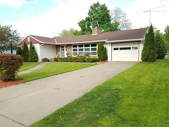 Front of home offering a large yard, front porch and landscape beyond belief!