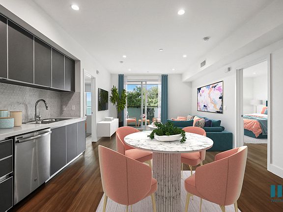 Open-Concept Kitchen, Dining, and Living Room with Patio