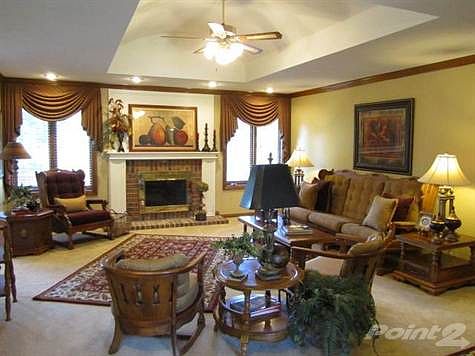 Formal Living Room with gas fireplace, beautiful ceiling treatment and textured walls and ceilings.