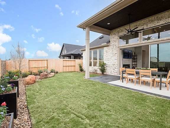 Longspur Plan Representative Only Outdoor Covered Living Backyard