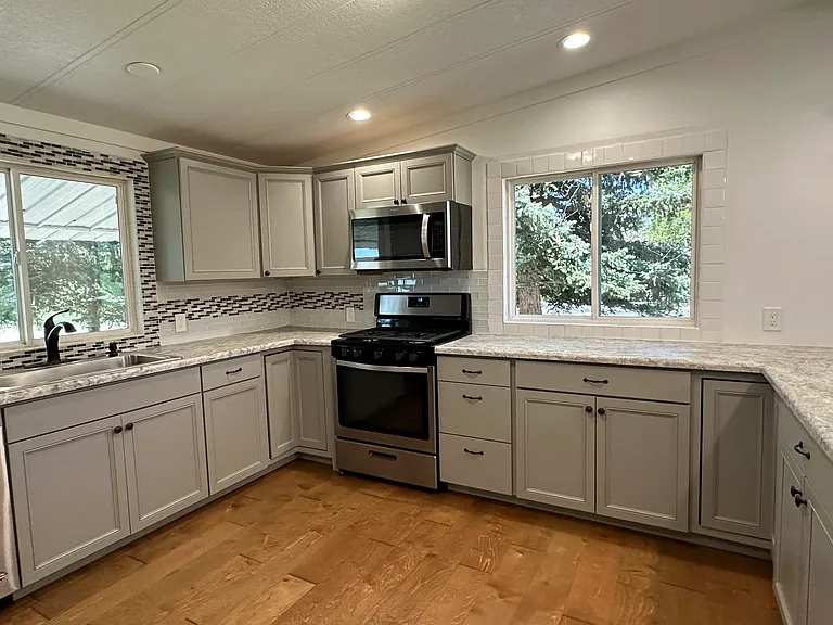 TONS OF STORAGE IN THE NEW KITCHEN CABINETS