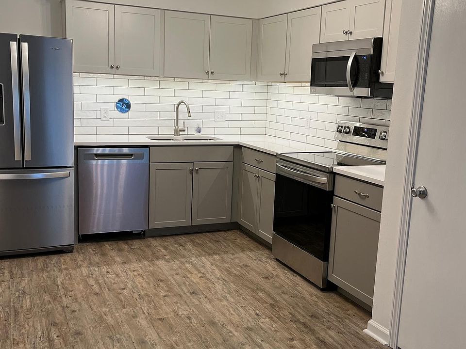 Updated kitchen with quartz counters, deep double sink, and premium appliances.