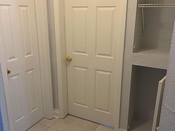 Hallway and linen closet leading to 2nd bathroom and 2nd bedroom