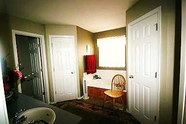 Master Bath with whirlpool and his/her closets