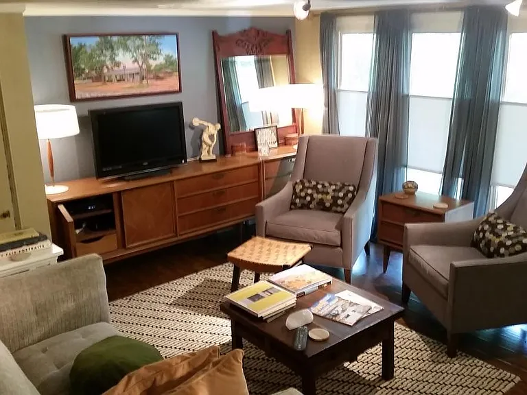 Front living area (Rm #1) with large windows. Space has been remodeled, and apt is unfurnished, but gives an idea of how the space has been used in the past.