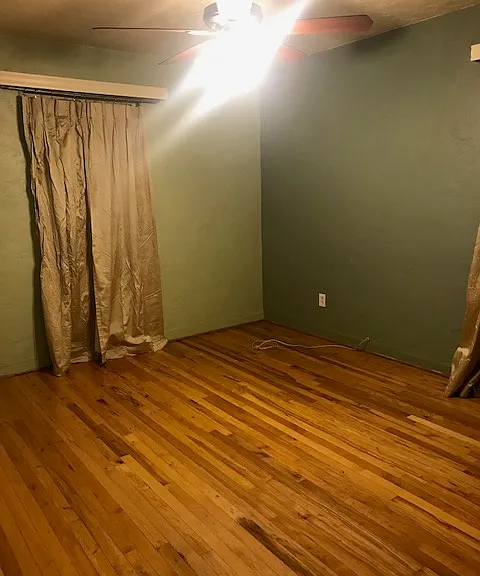 North bedroom with north and east facing windows.