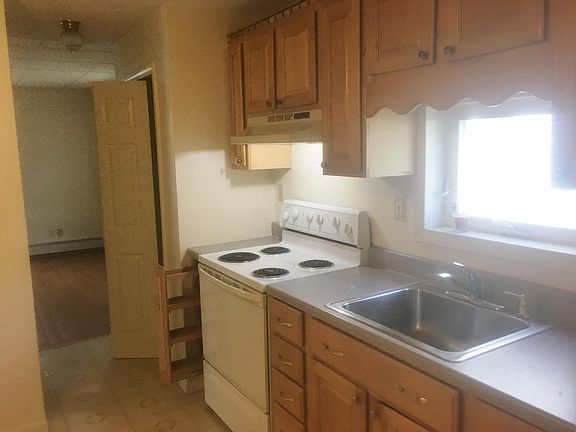 Large eat-in kitchen with lots of storage cabinets.