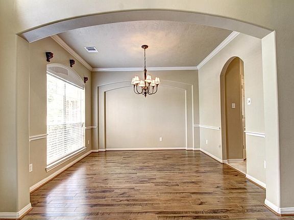 DINING ROOM - Very large and sun-filled with professional mill-work.