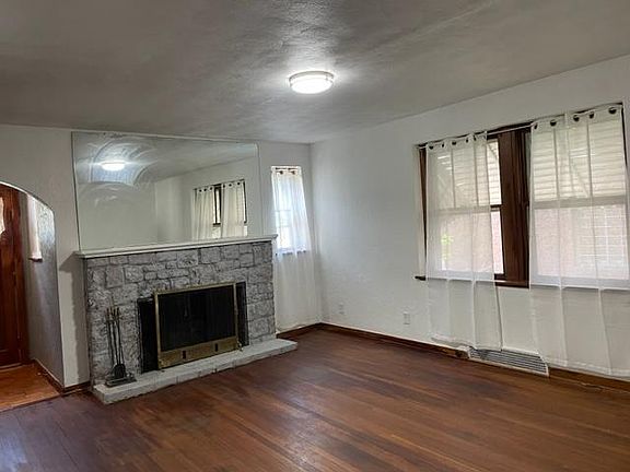 living room with huge working fireplace