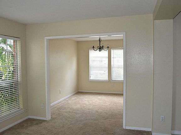 Formal Dining with Windows overlooking pool! Fresh wall paints!