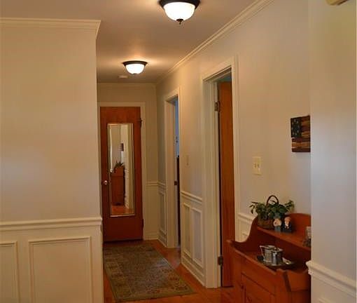 Hallway that leads to bedrooms and bathroom