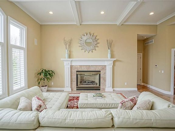 Huge Great Room w/ Fireplace and a Wall of Windows.