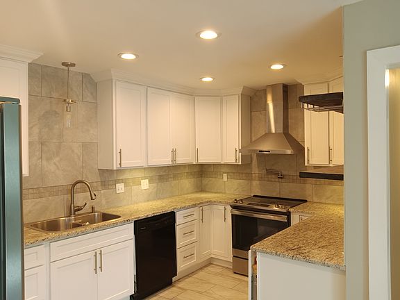 Kitchen with open shelving to the right