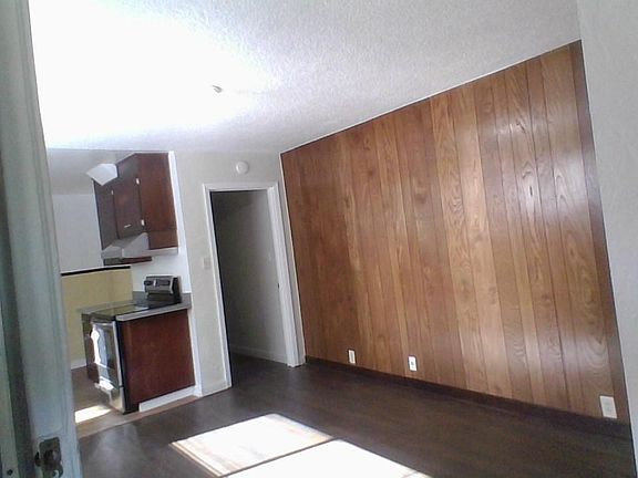 Entryway towards living area and kitchen