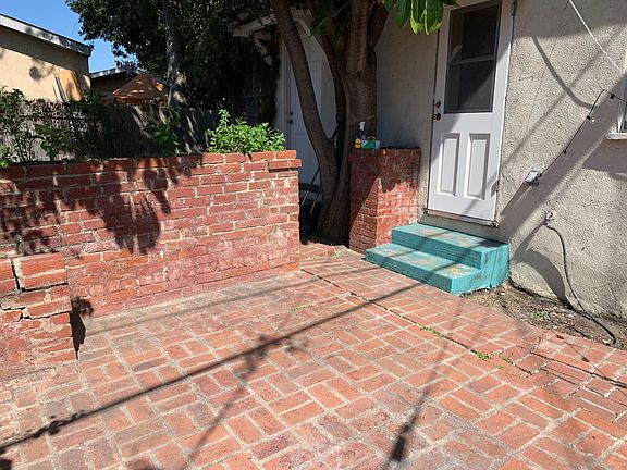 Next to the front door is the new kitchen door that opens to the patio area