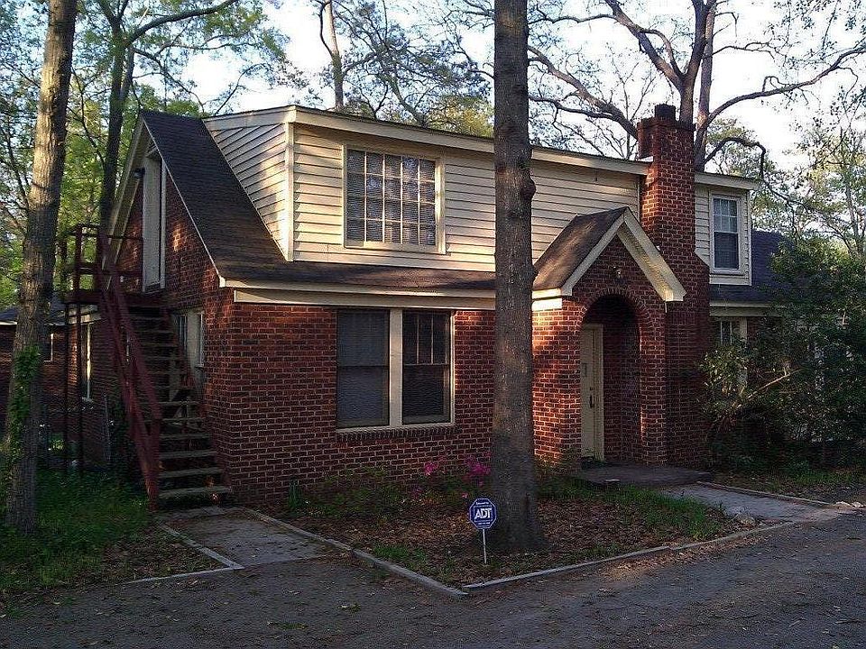 EXT. STAIRS TO UPSTAIRS APT