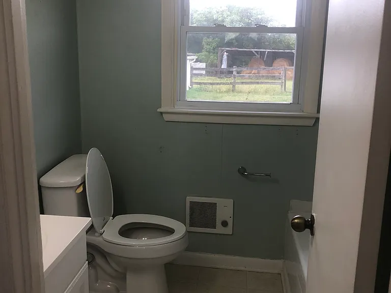Full bath with tub and shower.