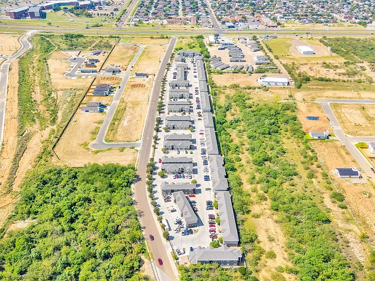 212_Obsidian_D-10 - Aerial perspective of La Joya Apartments, a suburban residential complex in Laredo, Texas, featuring the building's exterior