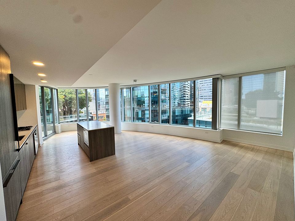 Spacious living room with near floor to ceiling windows