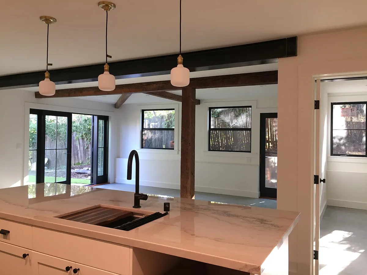 View from kitchen into living room. Door on right is looking into the bedroom. - San Anselmo Ave