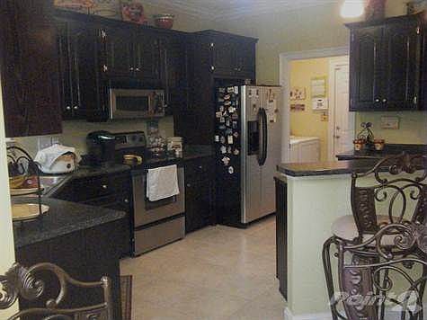 features cherry cabinetry