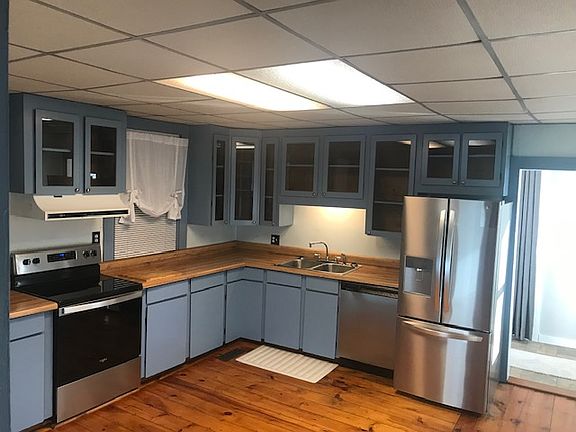 Kitchen with updated stainless steel appliances.