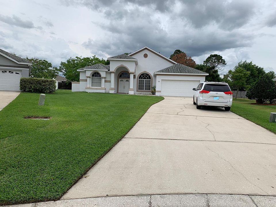 Exterior. Extra long driveway. 3 bedroom, 2 bath, 2 car garage - split plan. Screened lanai. Nice neighborhood - set on 1/4 acre lot.