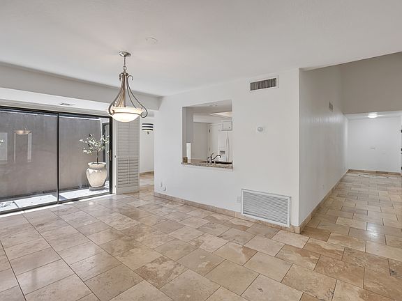 Dining area, kitchen and living room.