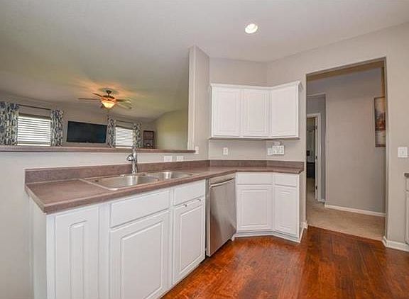 Kitchen has gorgeous wood floors