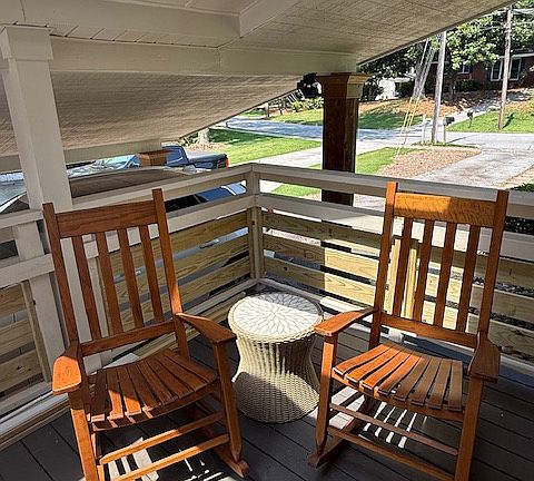 Front Street Side View and Must Have Rocking Chairs For Year Round Relaxation Under Covered Sun Filled Porch.